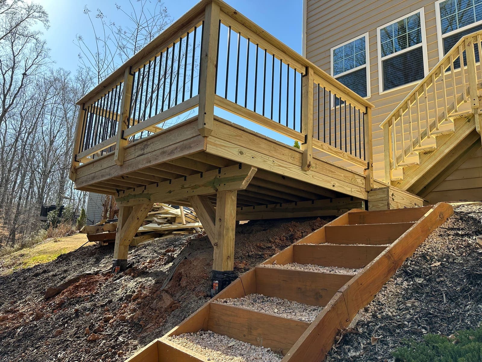 Inspiring multi-level deck design in a sloped backyard with natural elements.